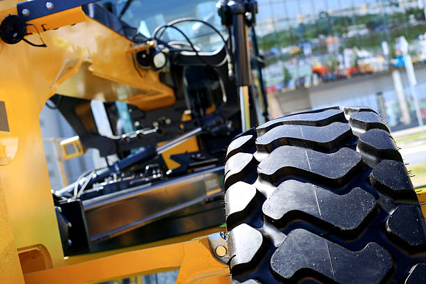 istock Big black wheel yellow construction truck 610653336