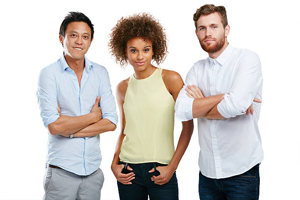 Diversity sure looks good Studio portrait of a diverse group of people posing against a white background three amigos stock pictures, royalty-free photos & images