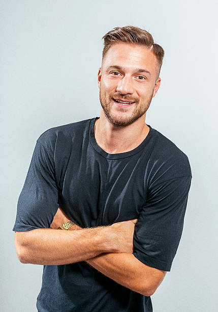istock Cheerful European young man smiling in studio 610654476