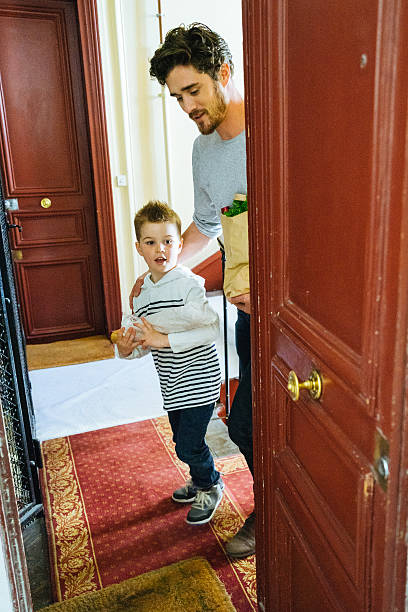 istock Father And Son Coming Back Home With Fresh Food 610654570