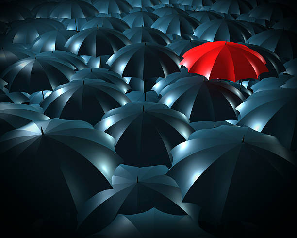 istock Standing out from the crowd concept with umbrellas 610655188