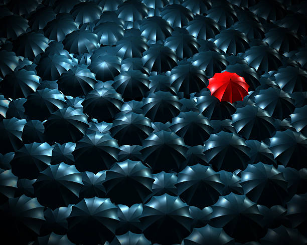 istock Standing out from the crowd concept with umbrellas 610655206