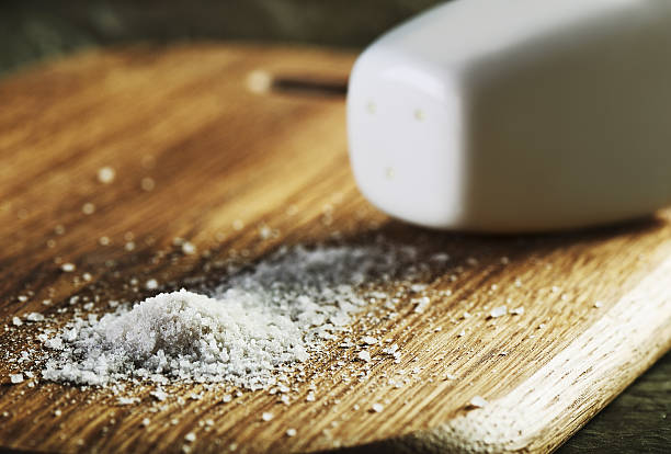 istock salt heap and shaker on a cutting board horizontal 610655984