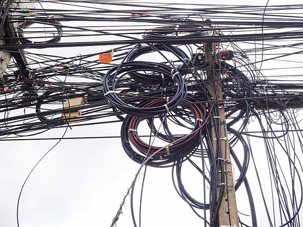 istock Chaos of cables and wires on electric pole in Chiang 610658564