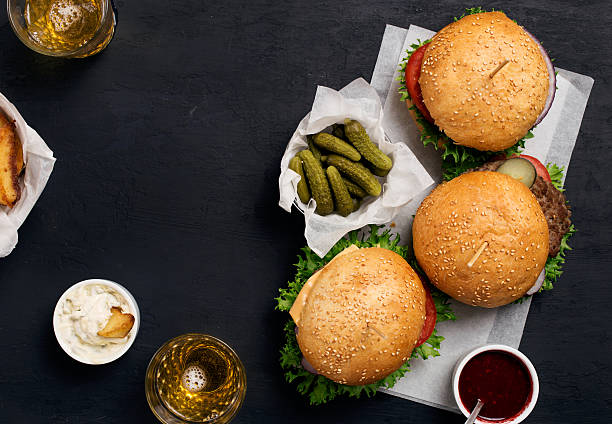 istock Different burger with pickles, ketchup, mayonnaise, fries and li 610658588