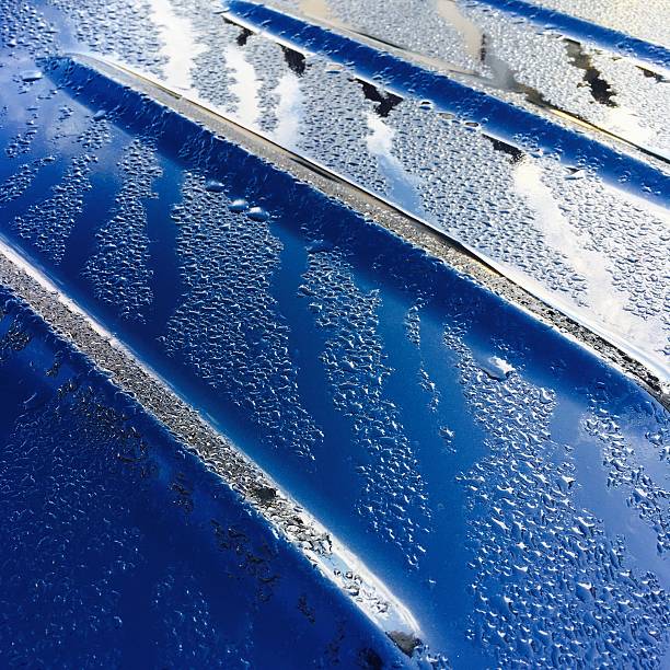 istock Modern car wetted by dew, brightly lit 610660354