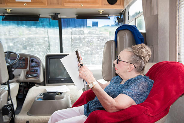 istock Senior woman sitting in RV 610661254
