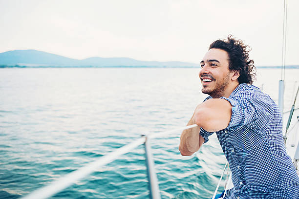 istock Happy man traveling on a yach 610661682