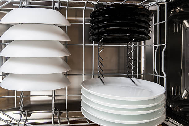 istock White and black plates after cleaning 610662158