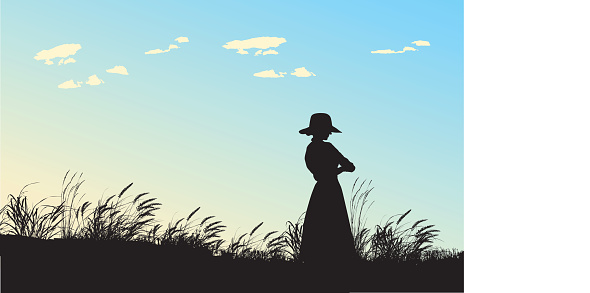 A vector silhouette illustration of a woman in a sun hat and long dress standing in a field of grasses blowing in the wind behind a blue sky and white clouds.
