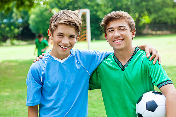 istock Brothers on opposing soccer teams before game 610664182