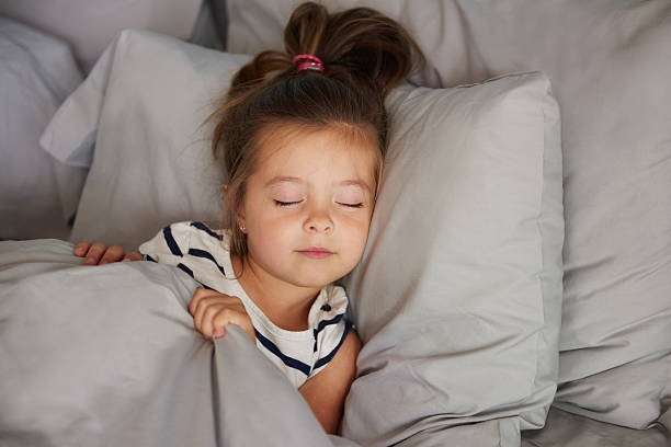 istock Sleeping girl in the bed 610664716