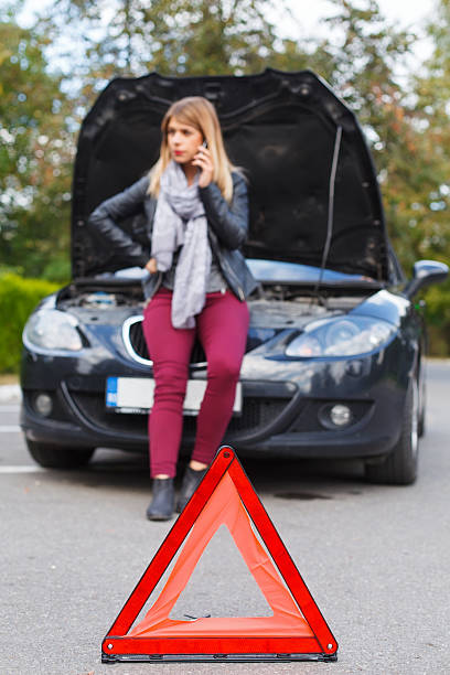 istock Unhappy woman with broken car 610665530