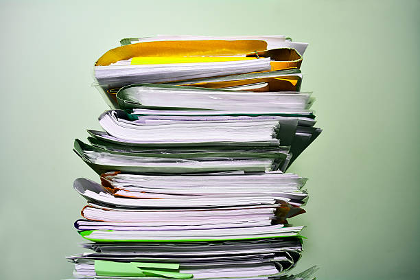 Stack of files Stack of files on the desk inbox filing tray stock pictures, royalty-free photos & images