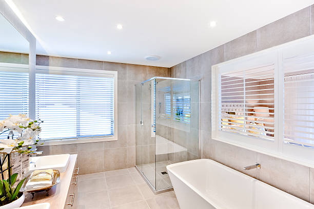 istock Modern bathroom with a washbasin and shower area 610667446