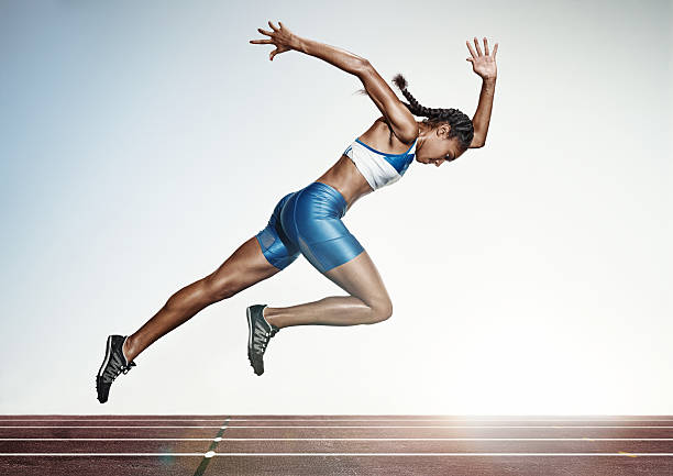The female athlete running on runing track The Young african woman running on runing track on white background. Studio shot sprint stock pictures, royalty-free photos & images