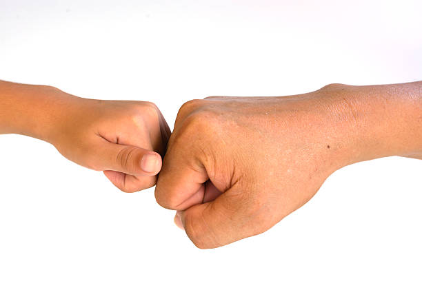istock Two hands: man and child, isolated on white 610667588