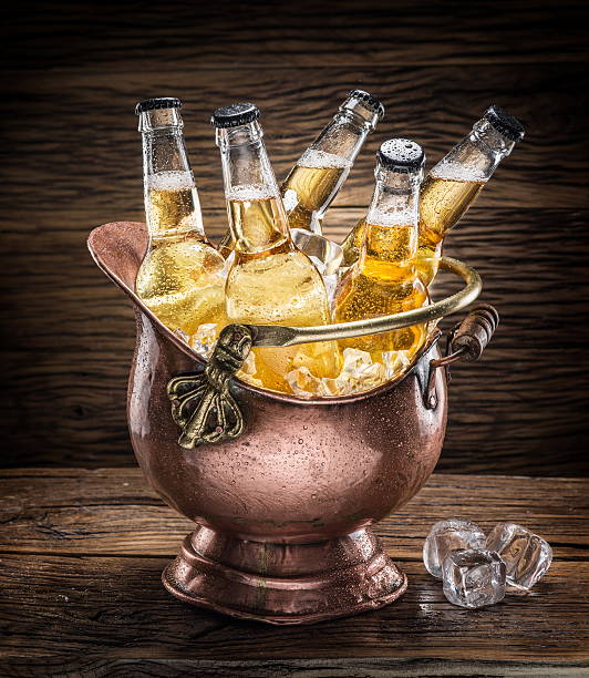 istock Cold bottles of beer in the brazen bucket. 610667828