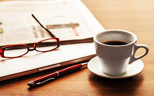 istock office working desk top view with laptop, notepad and coffee 610667926