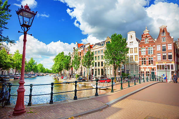 canal in amsterdam - amsterdam stok fotoğraflar ve resimler