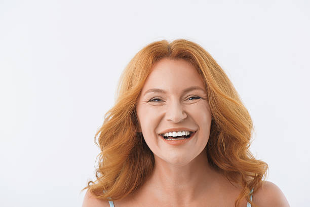 istock Middle-aged lady smiling with happiness 610669082
