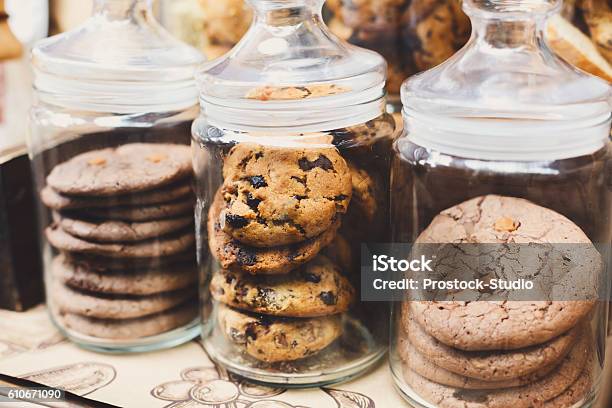 Cookies And Biscuits In Glass Jars On Bar For Sale Stock Photo - Download Image Now - Cookie, Jar, Variation