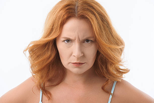 istock Mad mature lady staring at someone 610671704