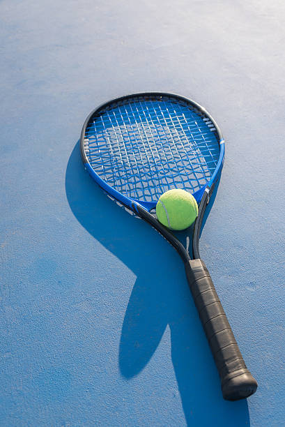 istock Tennis Ball and Racket 610672510