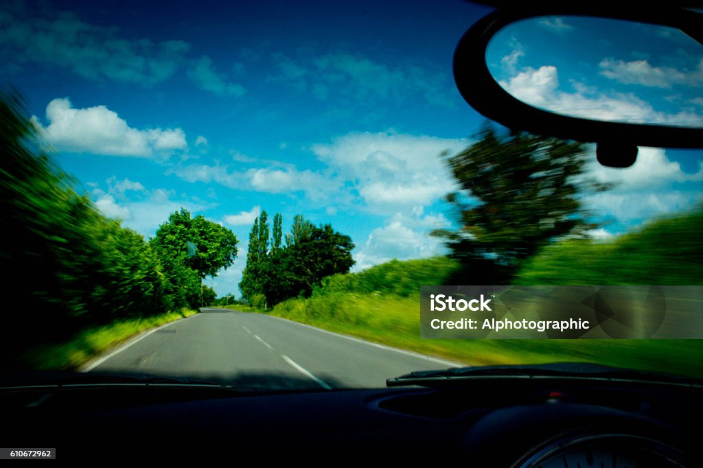 Mini Cooper interior A BMW Mini Cooper S convertible rear view mirror with a background of the beautiful Cambridgeshire countryside. Black Color Stock Photo