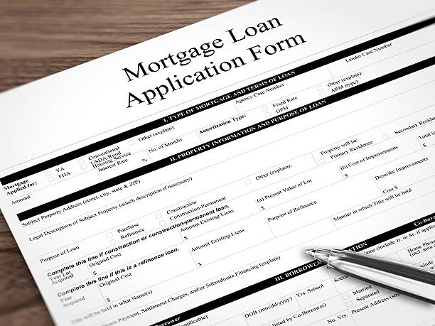 istock Mortgage loan application form contract wooden desk 610676402