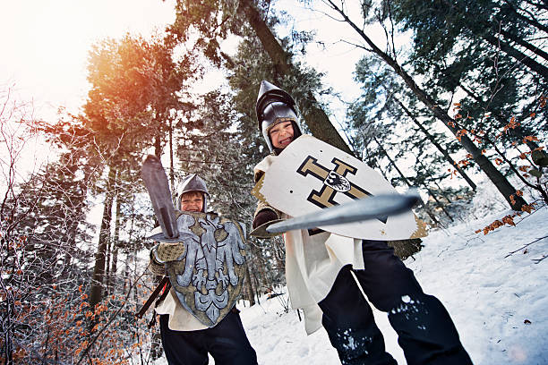 istock Little knights in frozen forest 610676840