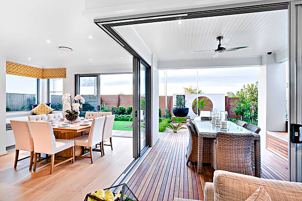 istock Modern dining room attached to outside patio area 610676860