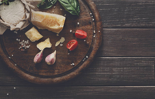 istock Cheese delikatessen closeup on rustic wood, brie and parmesan 610677148