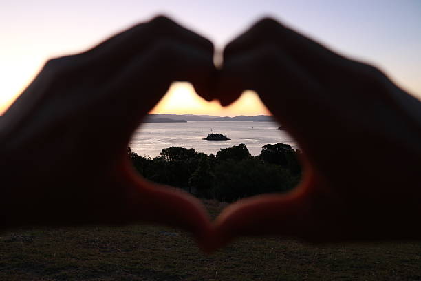 istock Sunset and heart island. 610679468