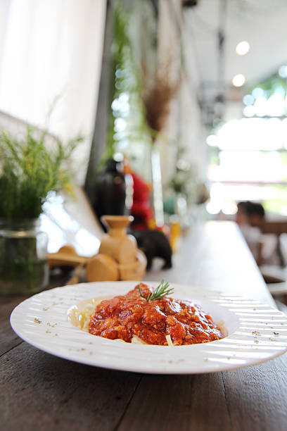istock spaghetti bolognese on wood background 610680510