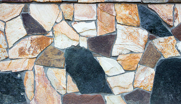 istock wall of a wild multi-colored natural stone texture 610681522