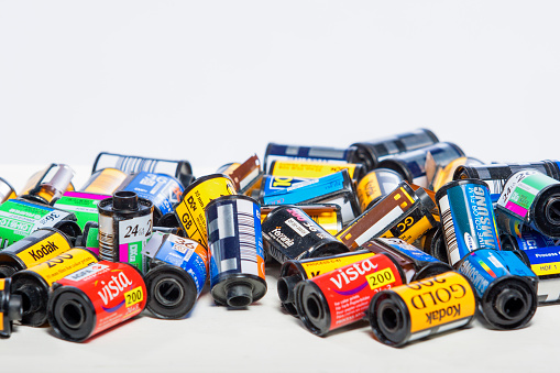 Minsk, Belarus-May 30, 2015: Bulk Variety of Old Photo Films Cassettes of Different World Leading Manufacturers Placed in Heap Together against White Background shot in Studio on May 30, 2015 in Minsk, Republic of Belarus