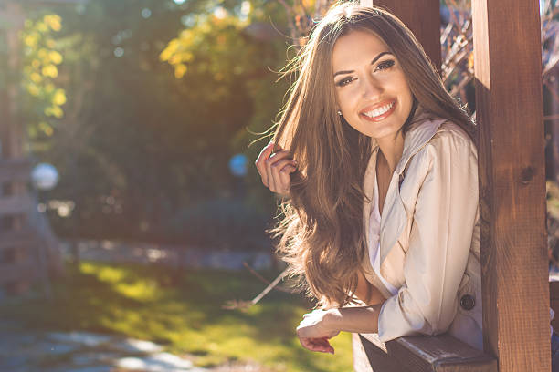 Portrait of smiling young woman, autumn time stock photo