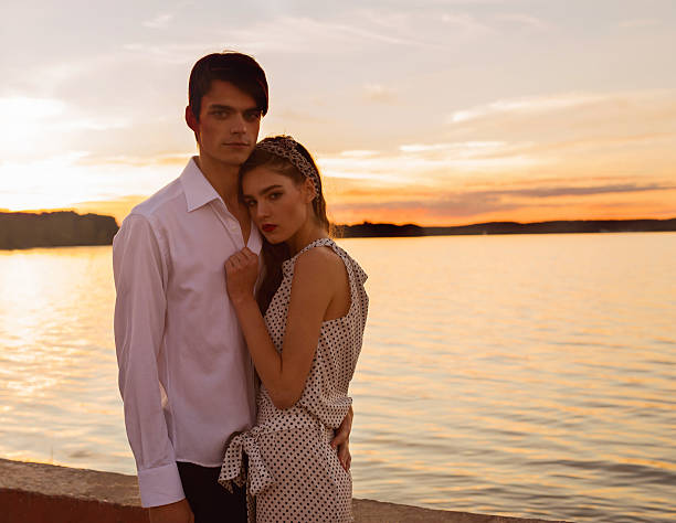 istock Attractive couple embracing  on a sunny day 610682644