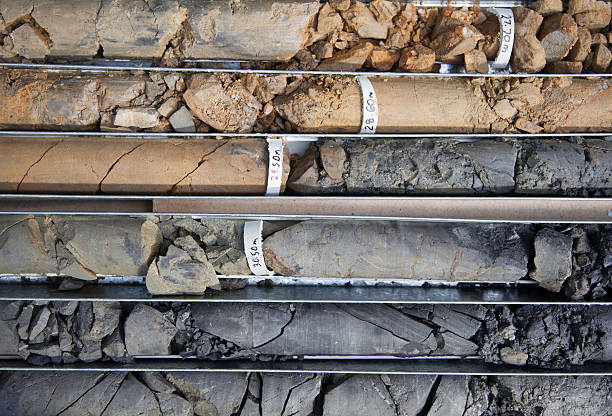 Drilled core samples Detail of boxed core samples from diamond core drill shale stock pictures, royalty-free photos & images