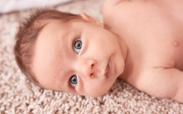istock cute baby boy with blue eyes 610684830