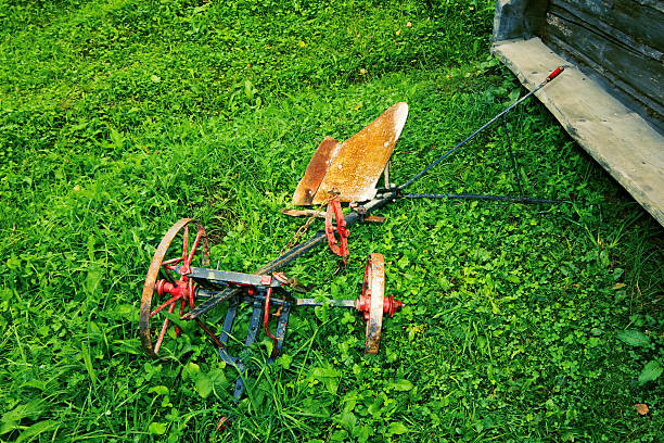 istock Old Rusty Farmers Tiller in Empty Field 610686116