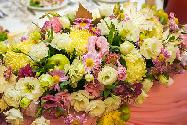 istock Wedding flowers in a banquet hall 610686276