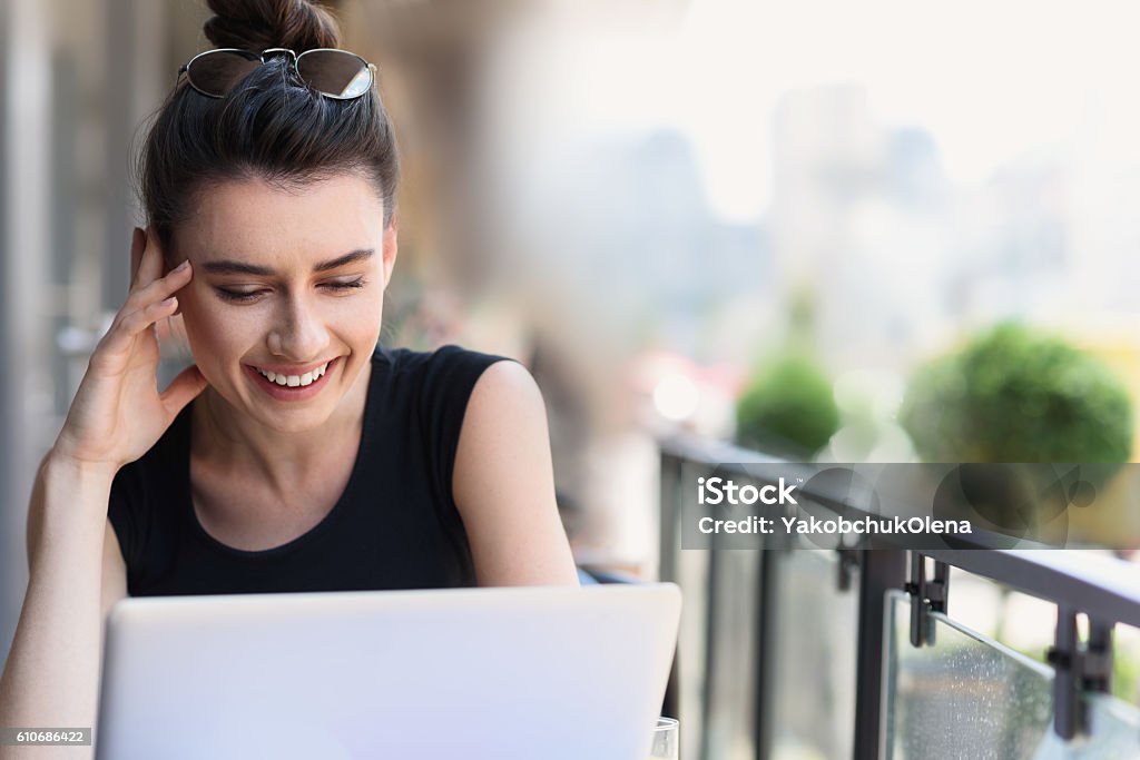 female freelancer at her workplace outdoors smiling girl working outside of a building Adult Stock Photo