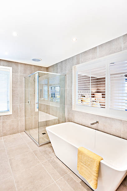 istock Modern washroom with space and tile floor with walls 610687056