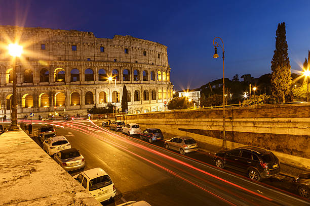 istock Colosseum and traffic lights at night 610687618