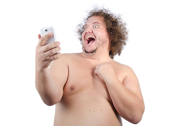 Fat guy and selfie. Funny fat man with a telephone. Naked and cheerful. Selfies. shaggy fur stock pictures, royalty-free photos & images