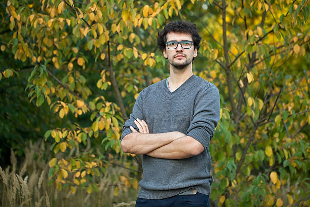 istock Thinking young man portrait on a sunny day. 610689632