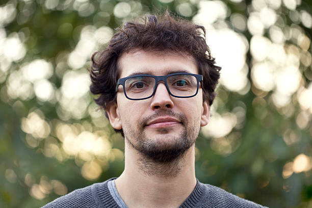 istock Happy young man looking at camera on a sunny day. 610690000