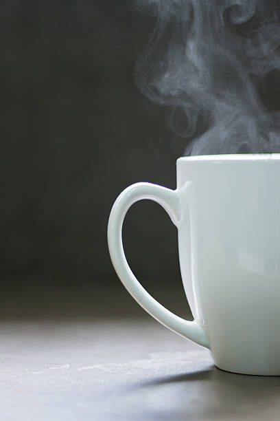 White steaming mug stock photo